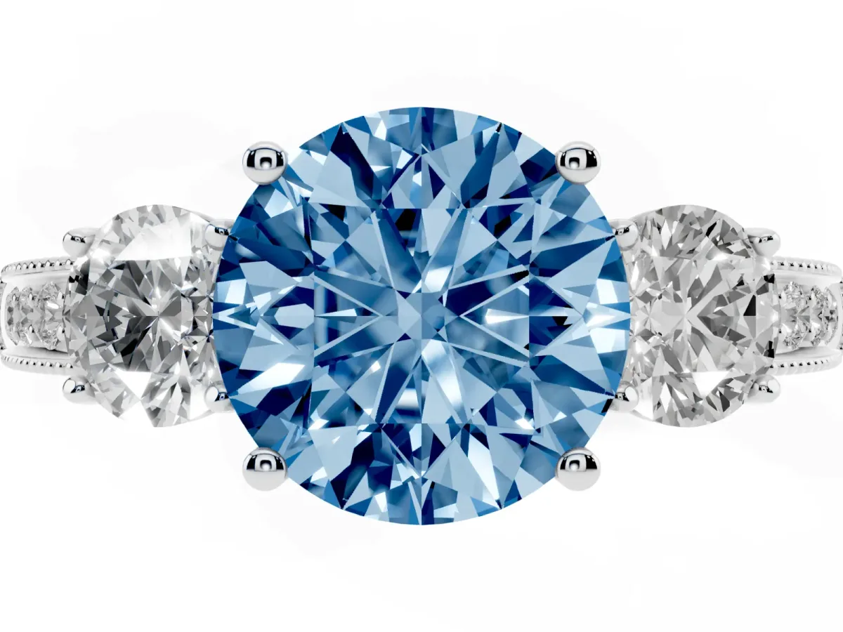 Fancy Blue Round Cut Three-Stone Diamond Ring with Pavé Band and Four-Prong Setting Silver