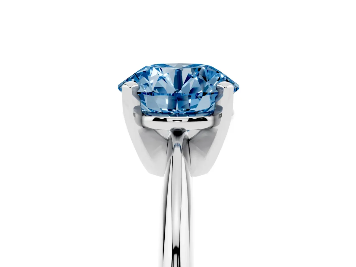 Fancy Blue Round Cut Cut Solitaire Ring with Four-Prong Setting on a Classic Band Silver