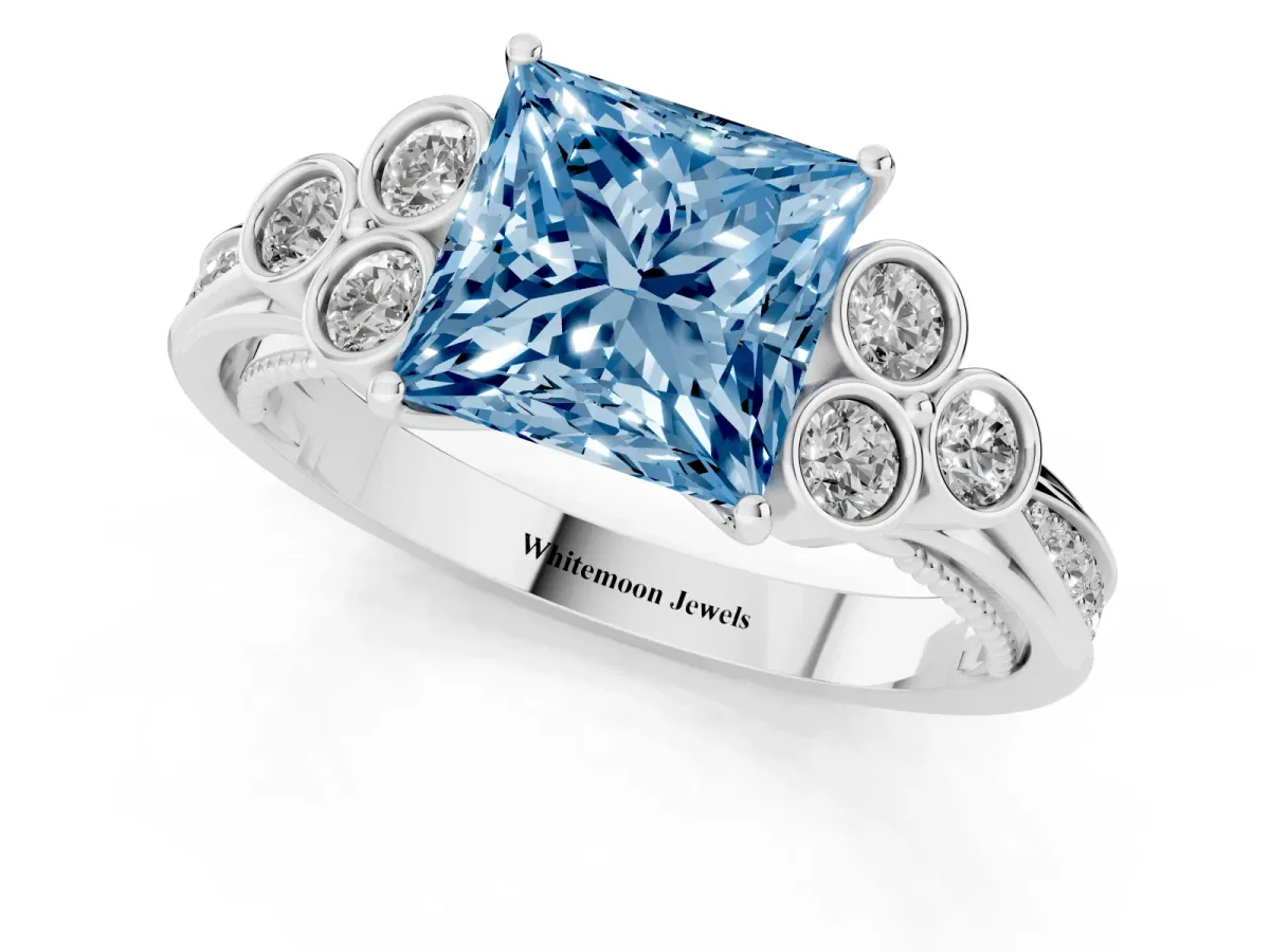 Fancy Blue Princess Cut Cut Diamond Engagement Ring with Bezel Set Round Side Stones and Prong Setting White gold