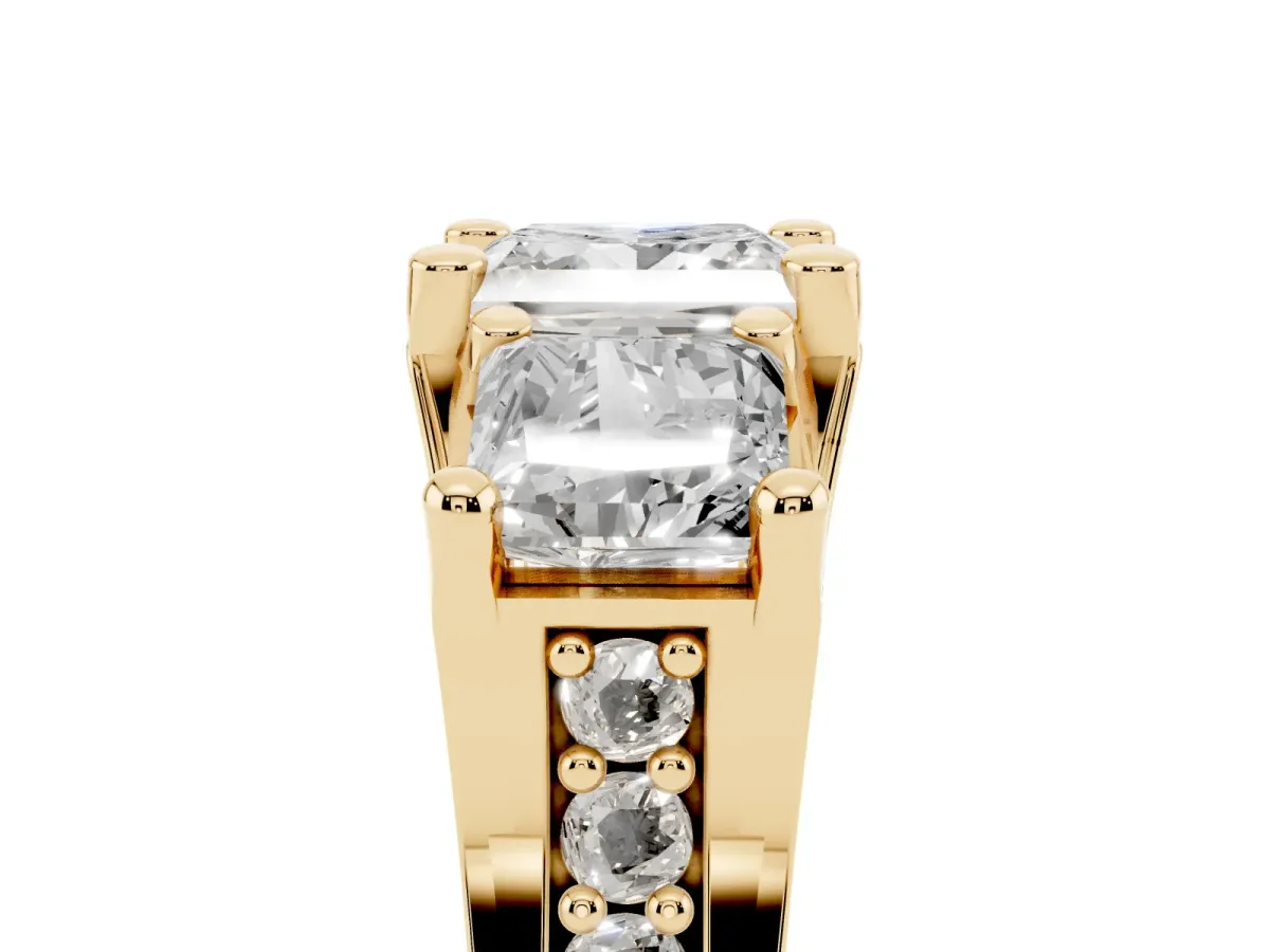 Princess Cut Diamond Three-Stone Ring with Channel Set Band and Four-Prong Setting Yellow gold
