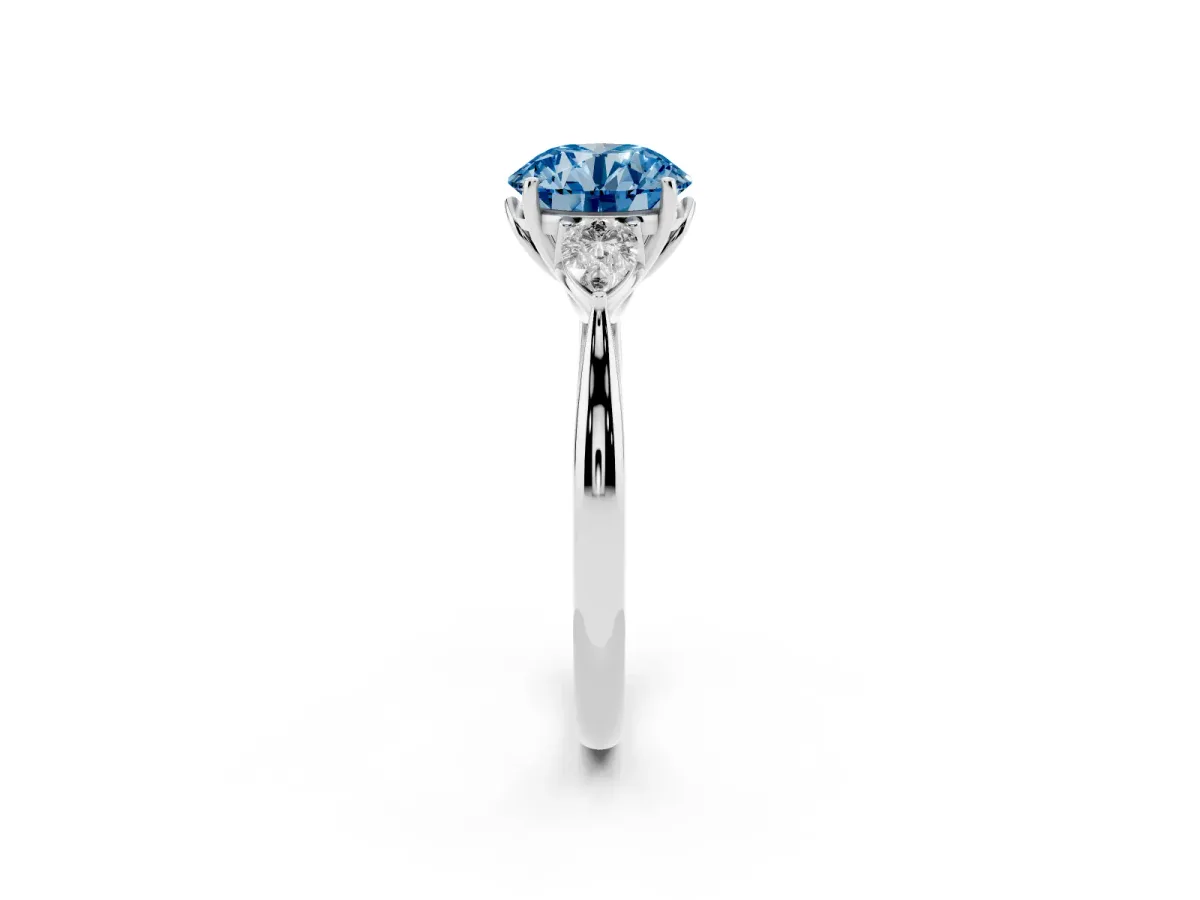 Fancy Blue Three-Stone Round Cut Diamond Ring with Pear Side Stones in Four-Prong Setting Silver