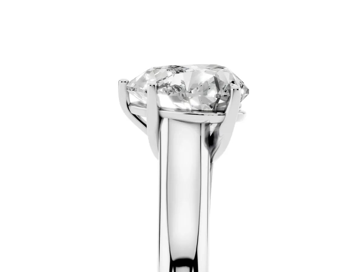Heart Cut Cut Diamond Solitaire Engagement Ring with Tapered Plain Band and Four-Prong Setting Platinum
