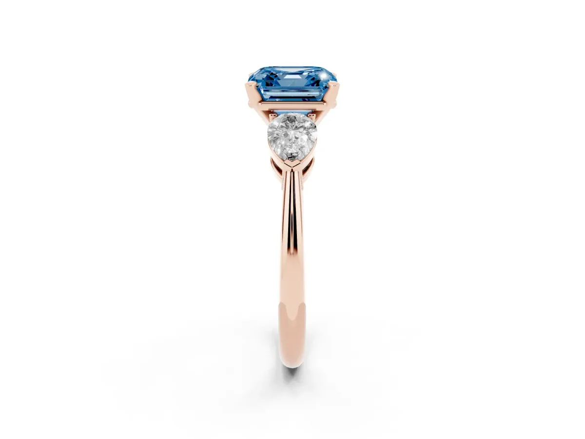 Fancy Blue Three-Stone Asscher Cut Diamond Ring with Pear Side Stones and Four-Prong Setting Rose gold