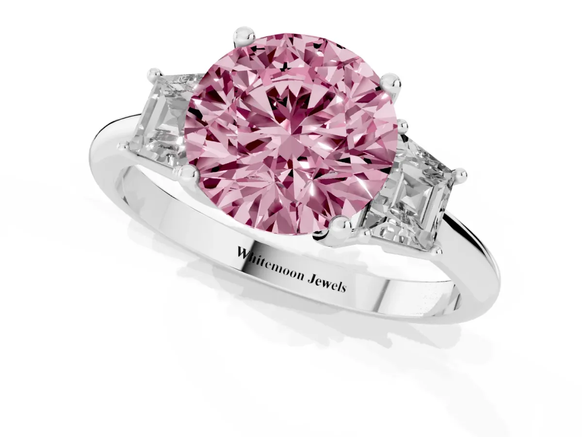 Fancy Pink Round Cut Diamond Three-Stone Ring with Trapezoid Side Stones and Prong Setting Platinum
