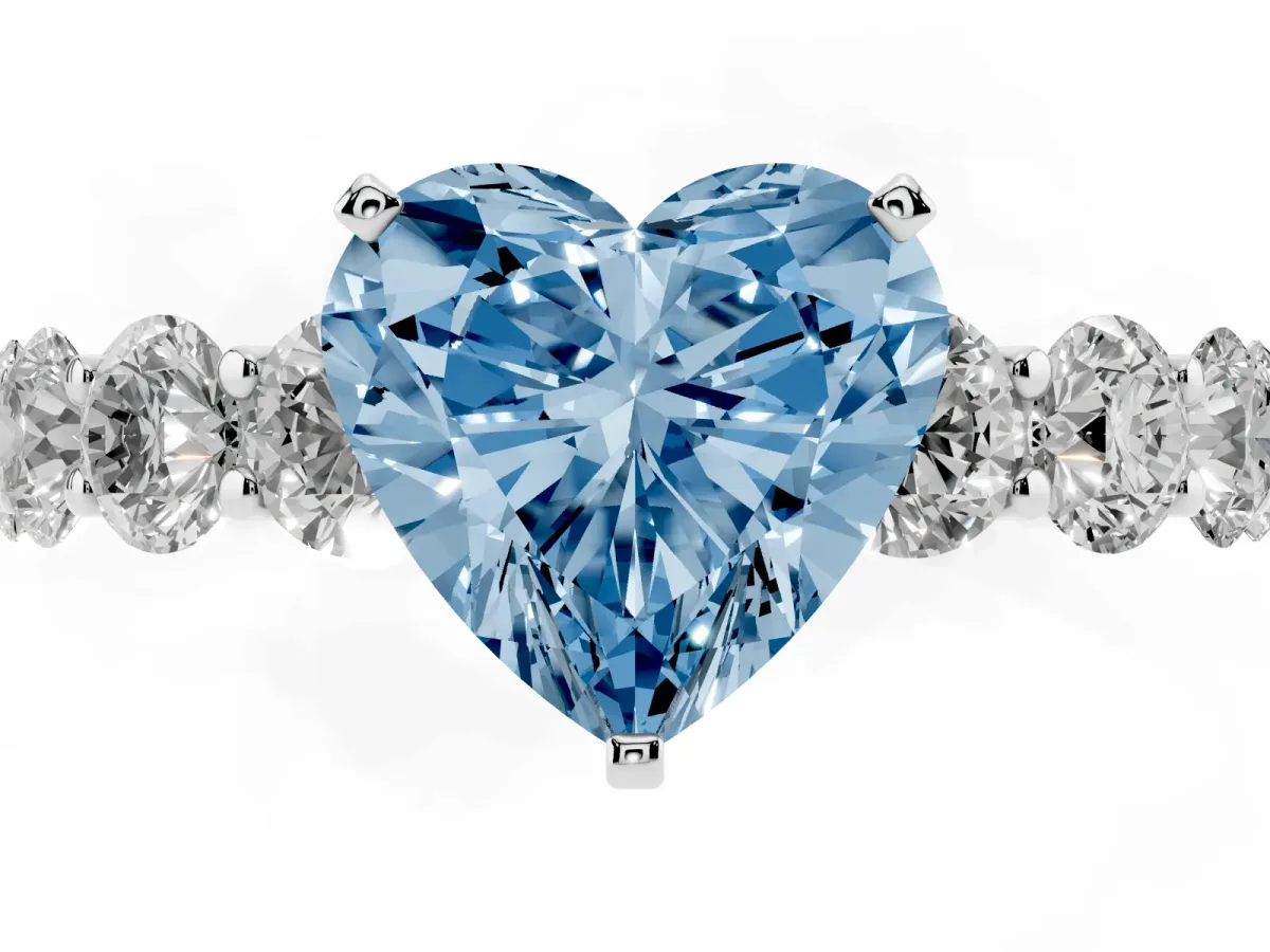 Fancy Blue Heart Cut Diamond Prong Setting with Side Stones on a Pave Band Silver