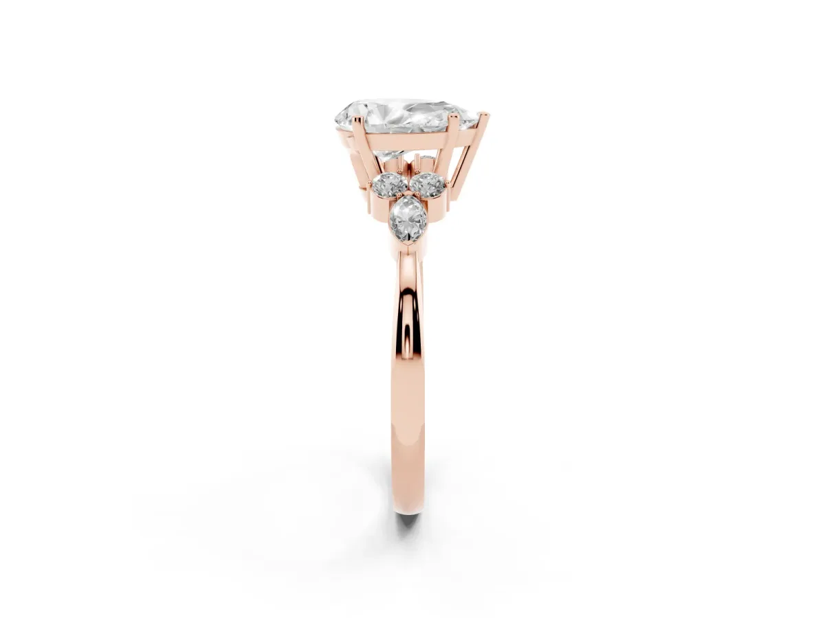 Pear Cut Brilliant Diamond Solitaire Ring with Pear Side Stones and Four-Prong Setting Rose gold