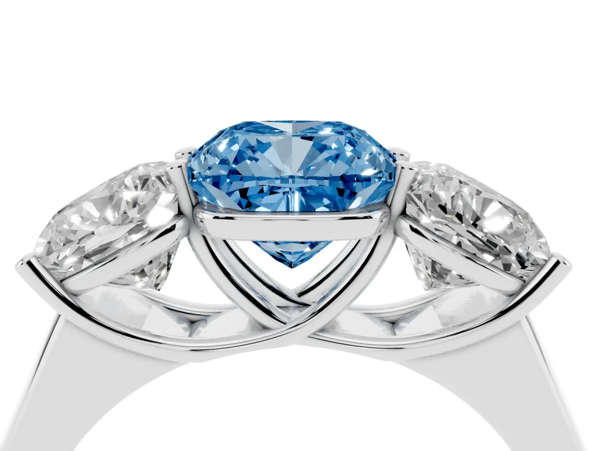 Fancy Blue Cushion Cut Three-Stone Diamond Ring with Prong Setting on a Classic Band Silver