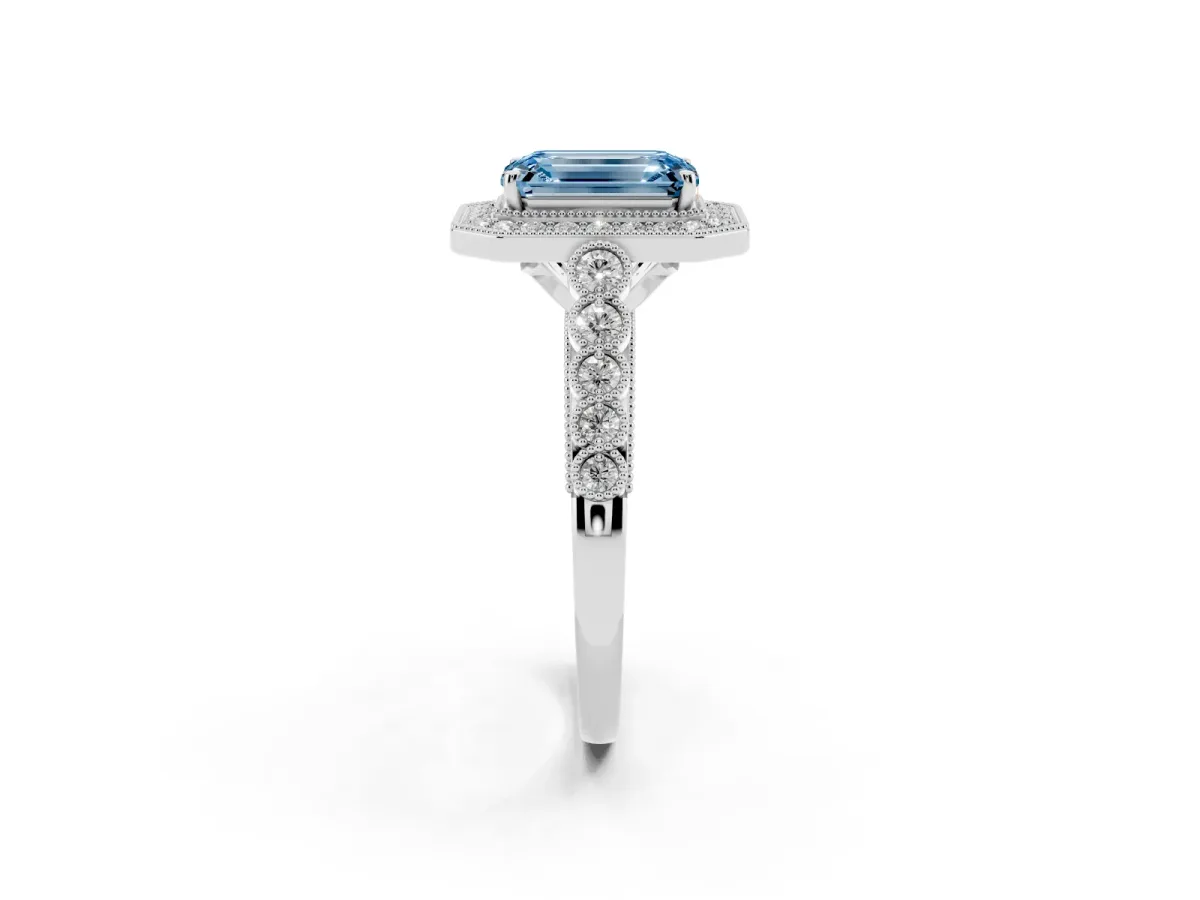 Fancy Blue Emerald Cut Halo Milgrain Solitaire with Bezel Set Side Stones and Pave Band White gold