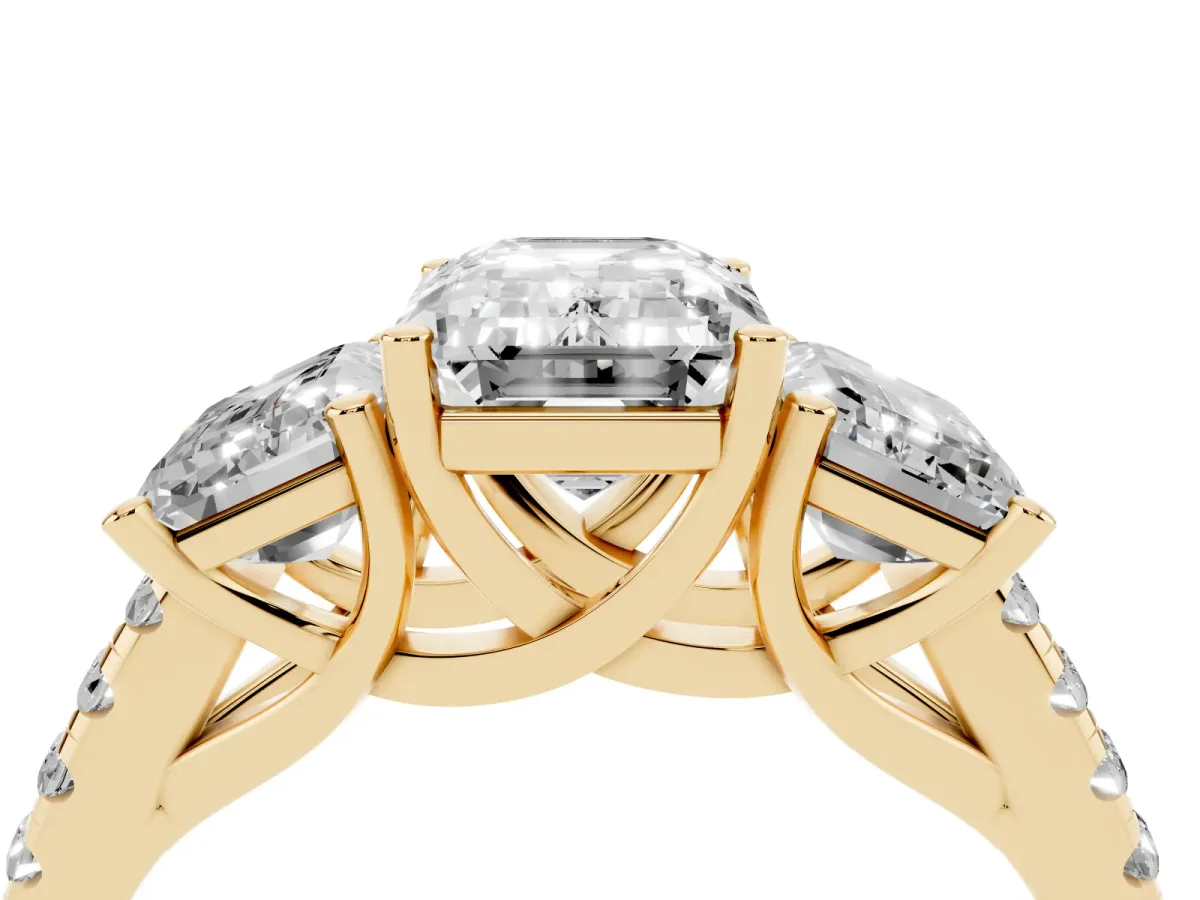 Three-Stone Emerald Cut Diamond Ring with Round Pavé Band and Prong Setting Yellow gold