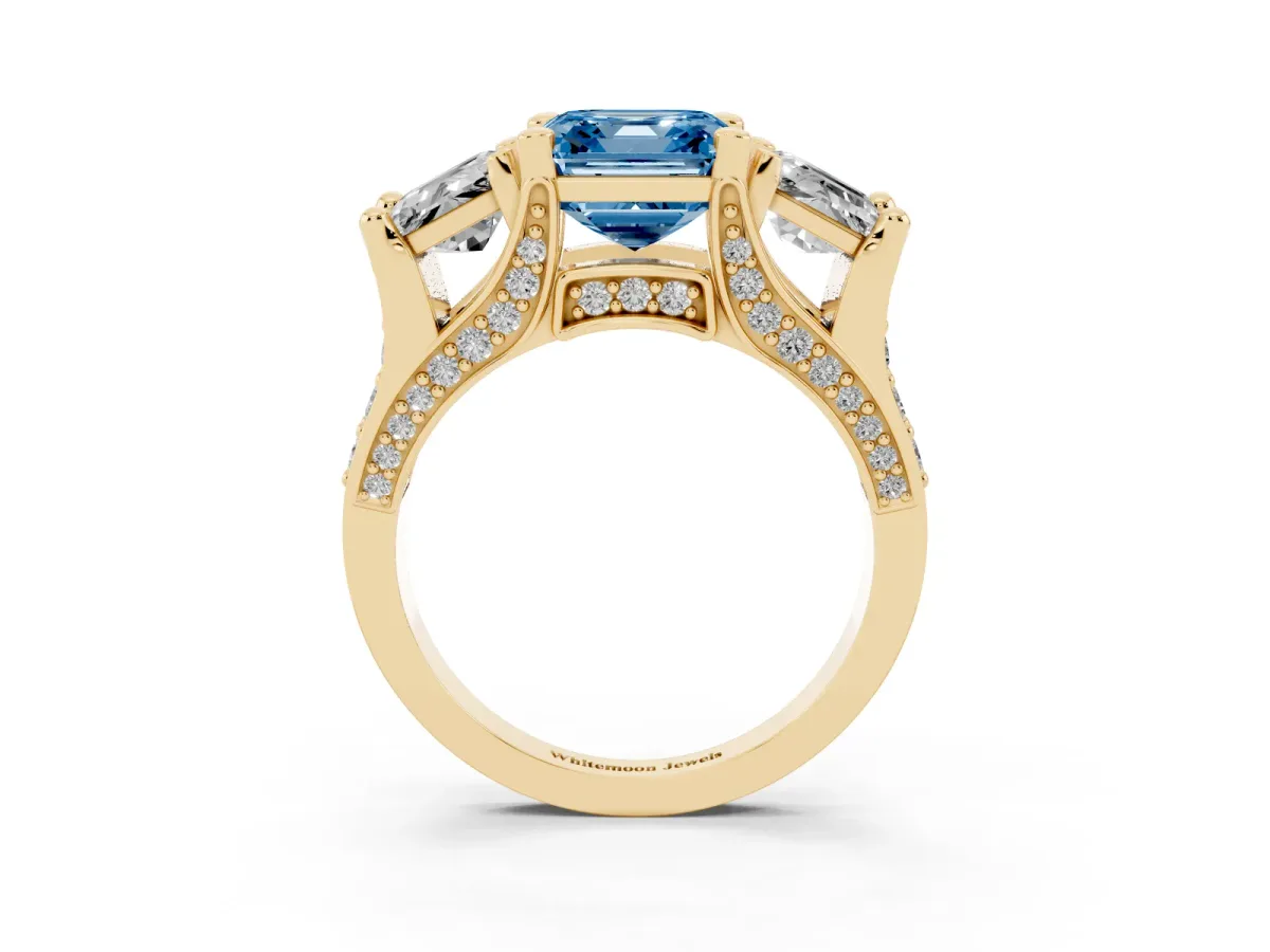 Fancy Blue Asscher Cut Diamond Three-Stone Ring with Channel Set Band and Four-Prong Setting Yellow gold