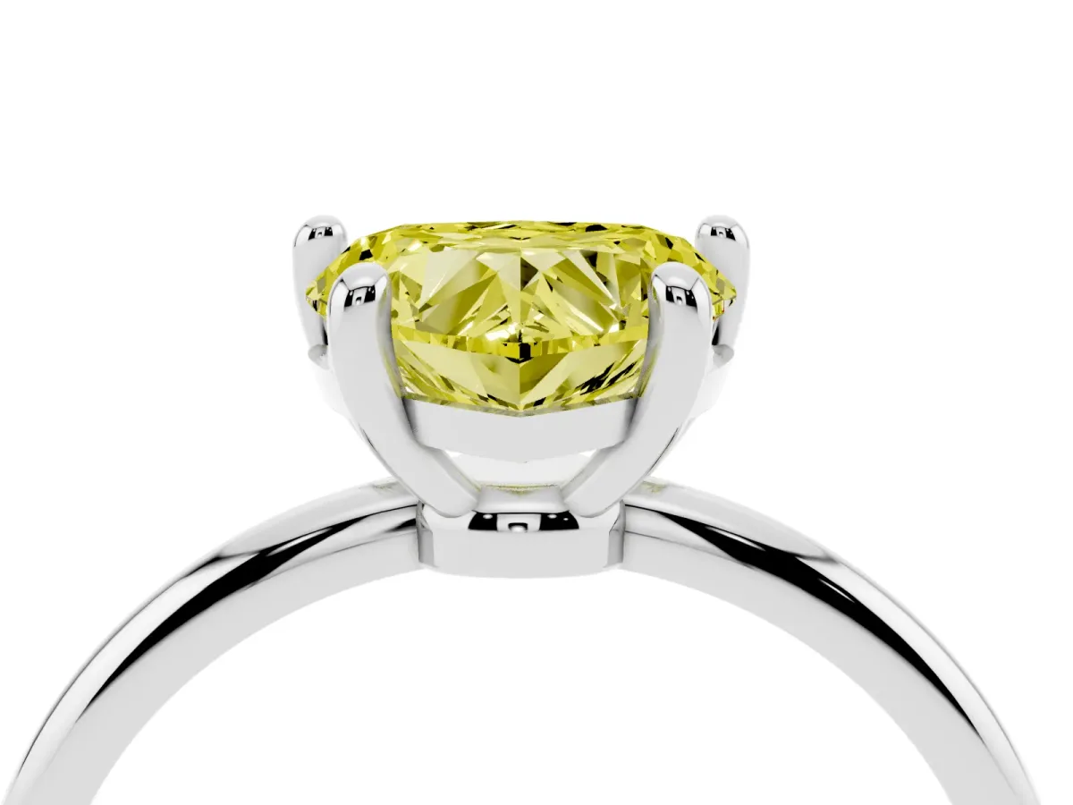 Fancy Yellow Heart Cut Solitaire Diamond Ring with 4-Prong Setting on a Classic Band Silver