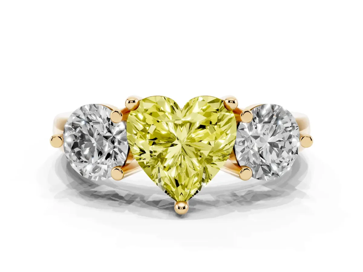 Fancy Yellow Three-Stone Heart Cut Brilliant Cut Solitaire Ring with Prong Setting on a Classic Band Yellow gold
