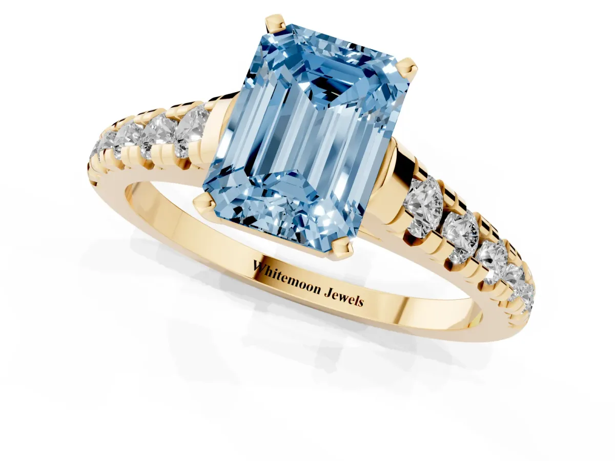 Fancy Blue Emerald Cut Diamond Cathedral Solitaire Ring with Round Pavé Band Yellow gold