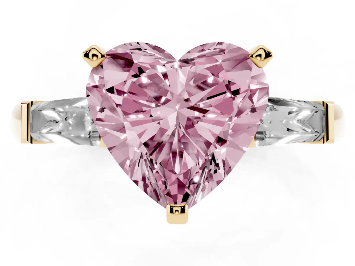Fancy Pink Heart Cut Solitaire with Tapered Baguette Side Stones on a Classic Band with Four-Prong Setting Yellow gold