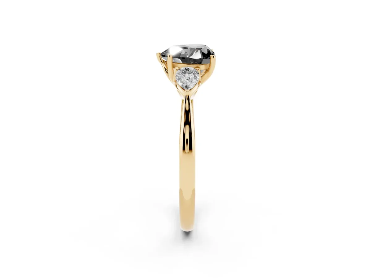 Fancy Black Heart Cut Diamond Three-Stone Ring with Pear Side Stones and Prong Setting Yellow gold
