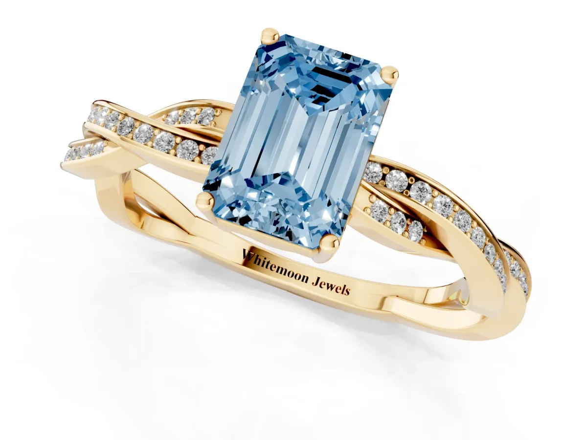 Fancy Blue Emerald Cut Solitaire Twisted Pave Diamond Ring with Four-Prong Setting Yellow gold