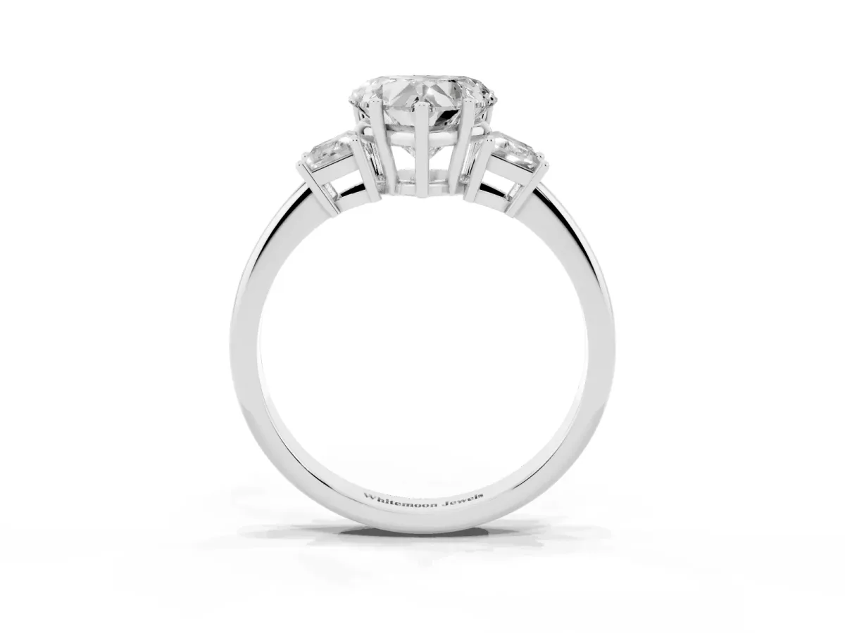 Heart Cut Diamond Three-Stone Ring with Trapezoid Side Stones and Prong Setting Platinum