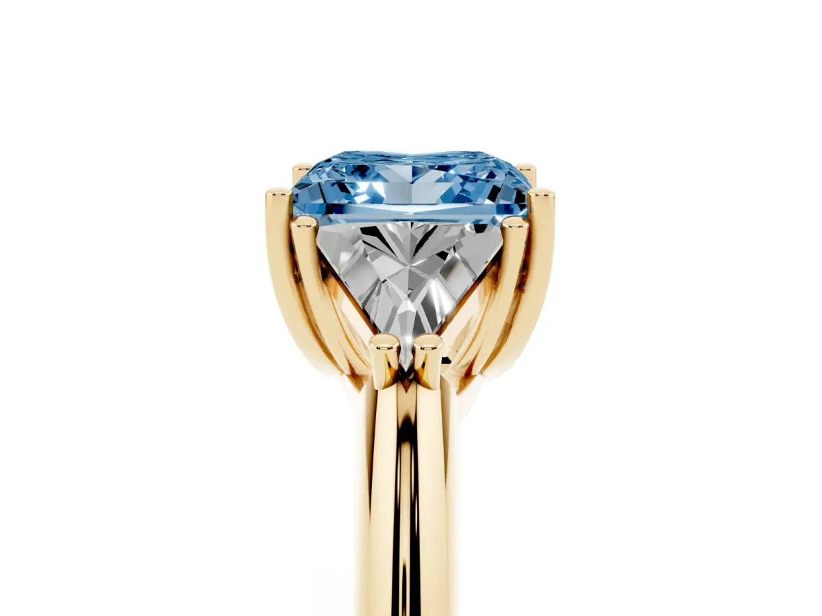 Fancy Blue Three-Stone Princess Cut Diamond Engagement Ring with Trillion Side Stones and Prong Setting Yellow gold