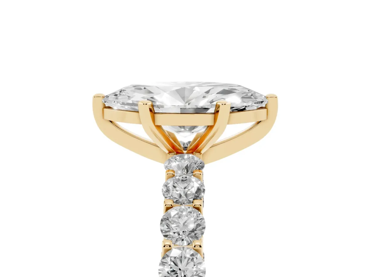 Marquise Cut Diamond Solitaire Ring with Shared Prong Pavé Band and Four-Prong Setting Yellow gold