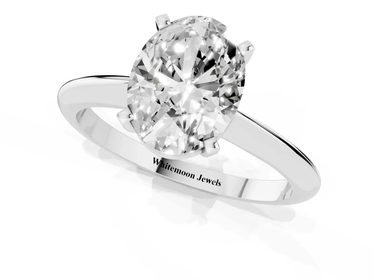 Oval Cut Cut Solitaire Ring with Four-Prong Setting on a Classic Band Platinum