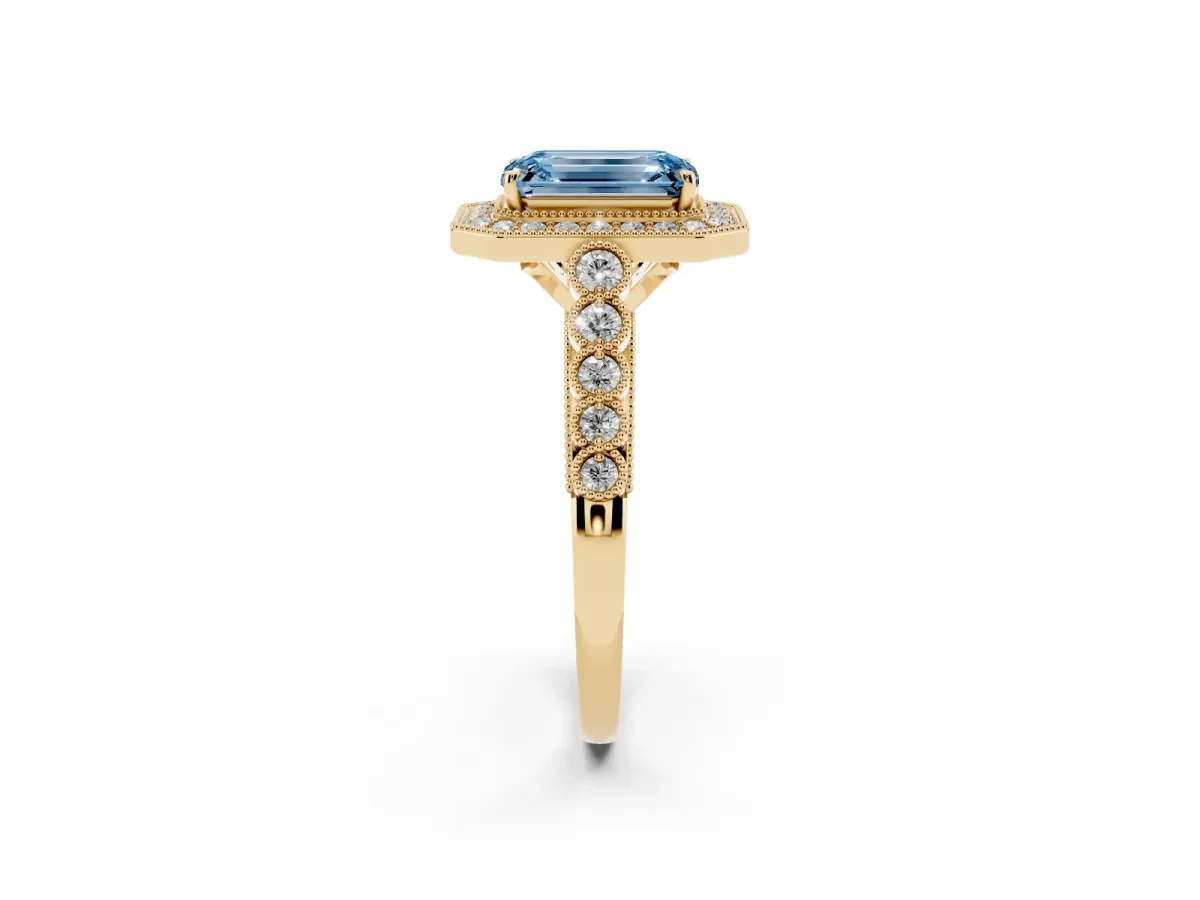 Fancy Blue Emerald Cut Halo Milgrain Solitaire with Bezel Set Side Stones and Pave Band Yellow gold