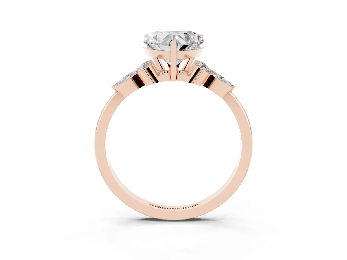 Heart Cut Brilliant Diamond Solitaire Ring with Pear Side Stones and Four-Prong Setting Rose gold