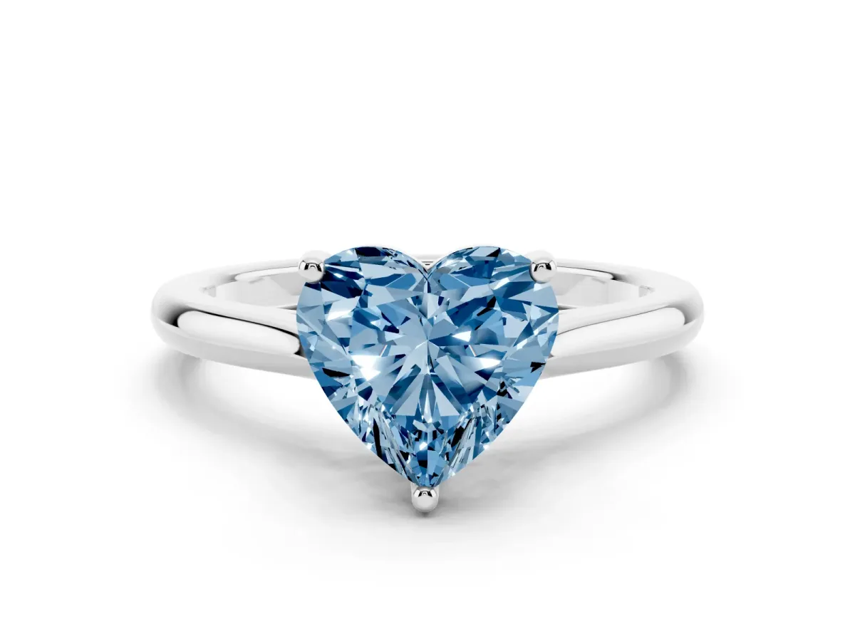 Fancy Blue Heart Cut Cut Solitaire Ring with Cathedral Band and Four-Prong Setting Silver