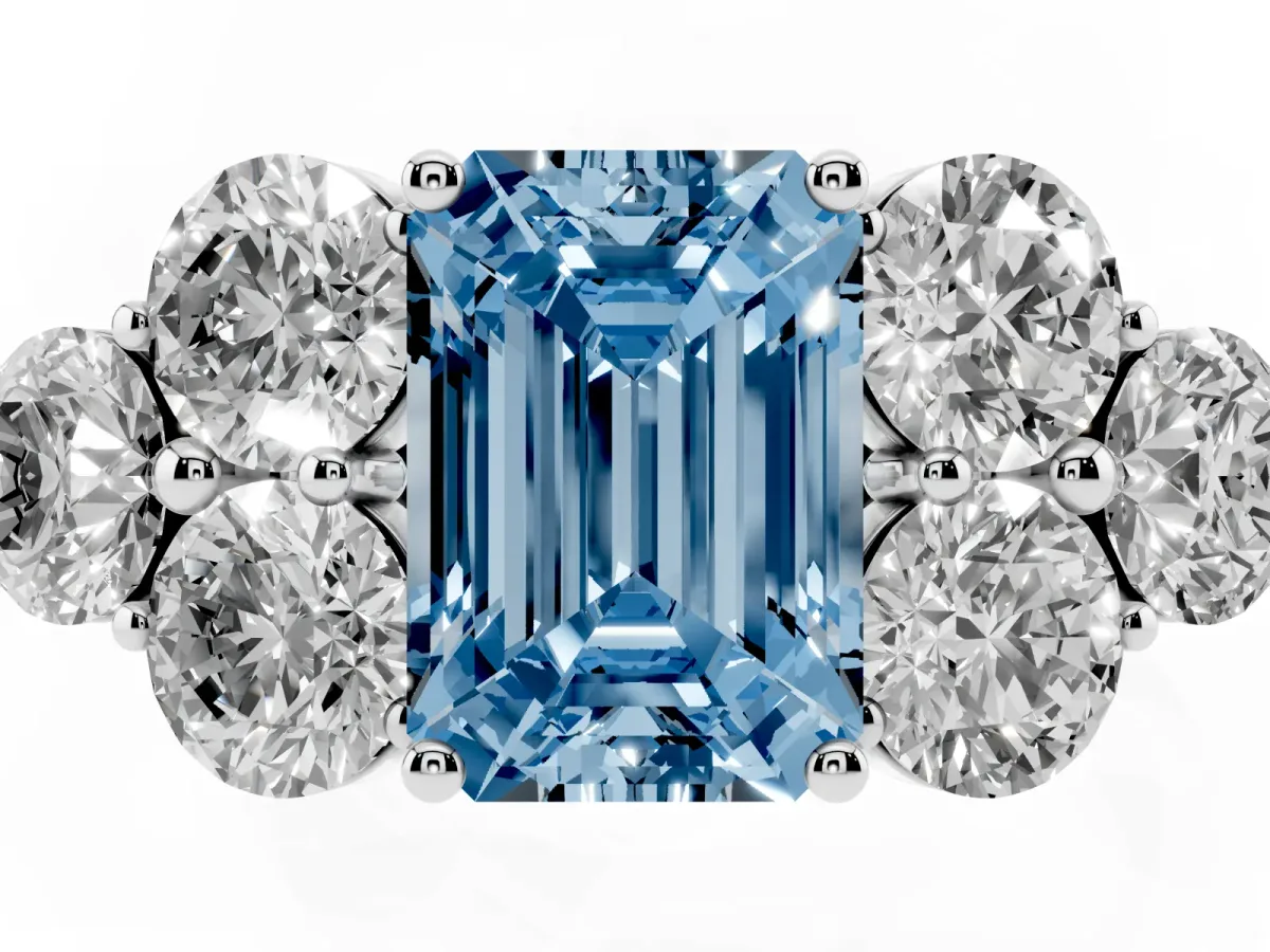 Fancy Blue Emerald Cut Cut Diamond Cluster Ring with Round Accent Stones and Prong Setting on a Classic Band White gold