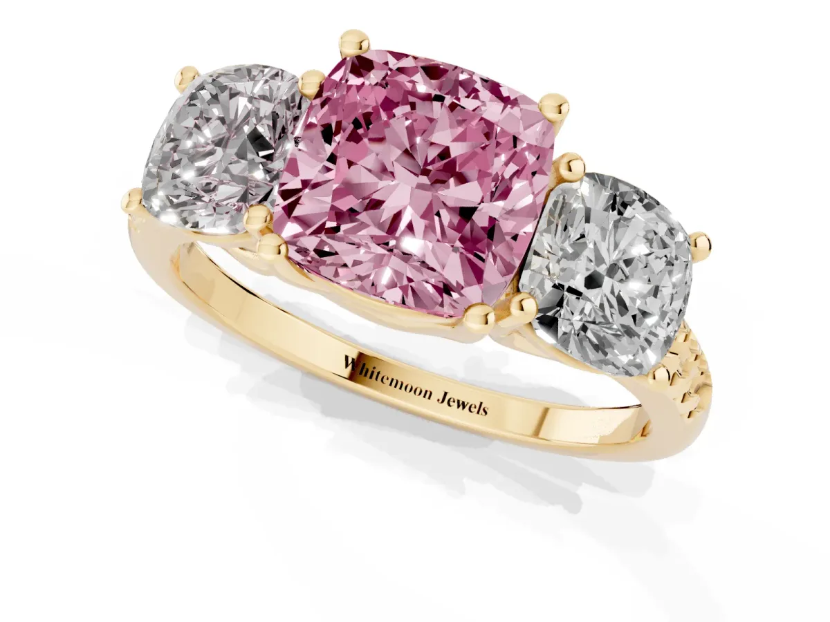 Fancy Pink Three-Stone Cushion Cut Diamond Ring with Round Pavé Band and Prong Setting Yellow gold
