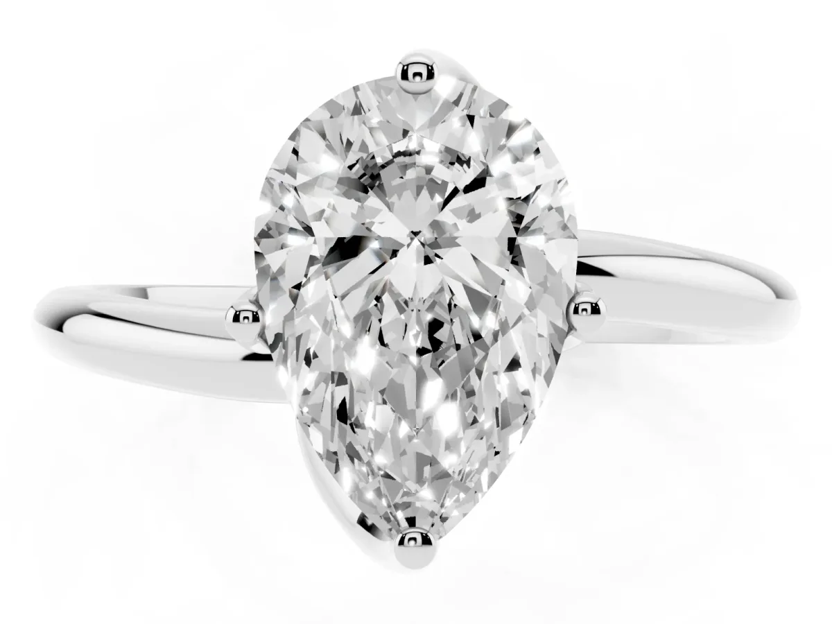 Pear Cut Diamond Solitaire Engagement Ring with Four-Prong Setting and Classic Band Silver