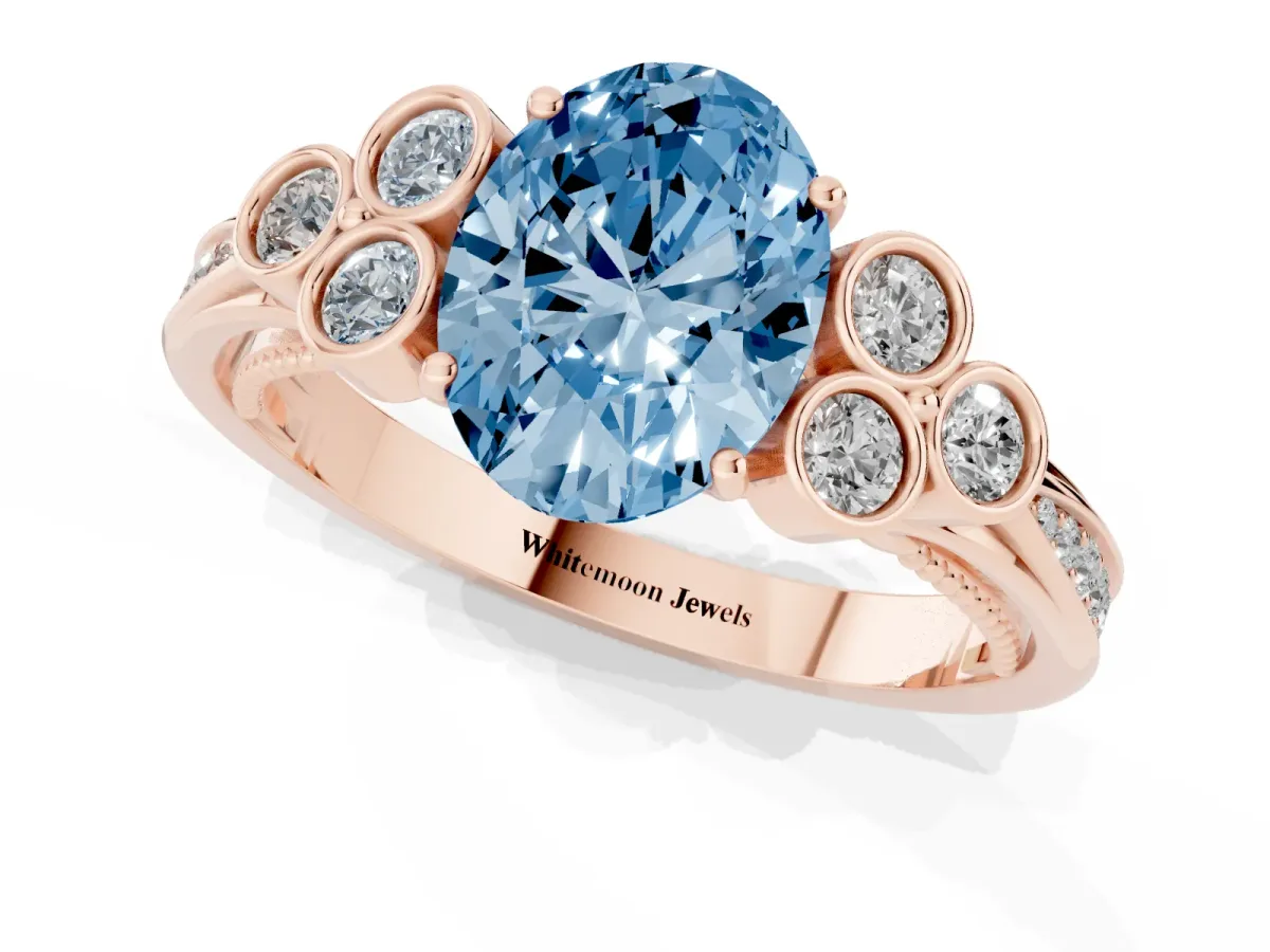 Fancy Blue Oval Cut Cut Diamond Engagement Ring with Bezel Set Round Side Stones and Prong Setting Rose gold