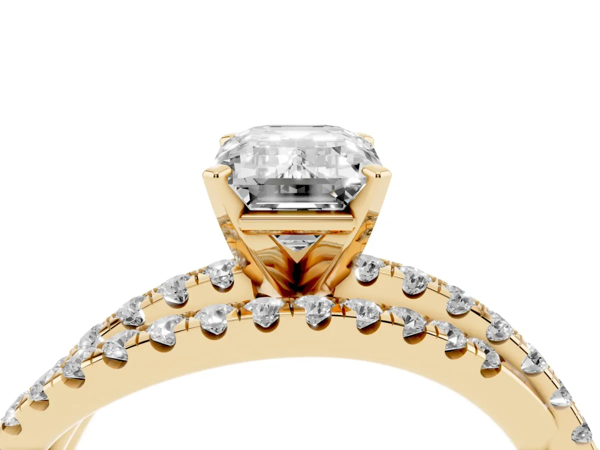 Emerald Cut Solitaire Twist Band with Pavé Setting and Four-Prong Setting Yellow gold