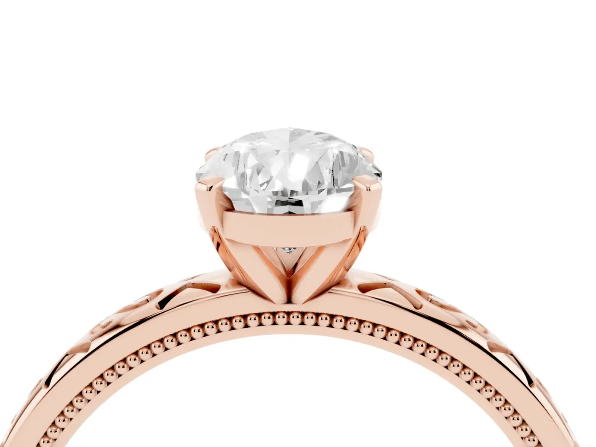 Pear Cut Solitaire Engagement Ring with Scrollwork Band and Four-Prong Setting Rose gold