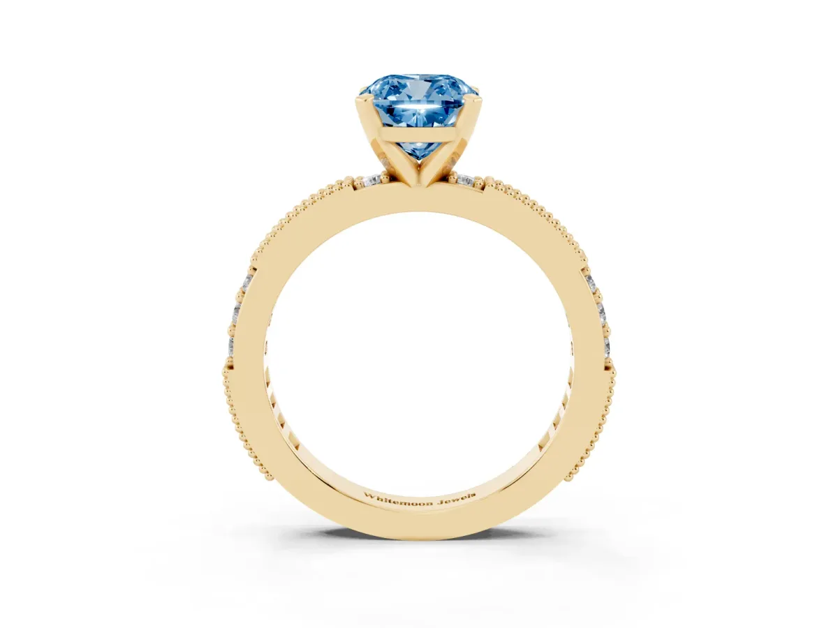 Fancy Blue Cushion Cut Solitaire with Pavé Band and Four-Prong Setting Yellow gold
