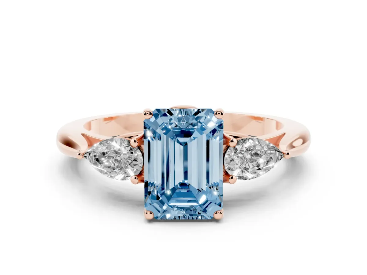 Fancy Blue Three-Stone Emerald Cut Brilliant Diamond Solitaire Ring with Tapered Band and Four-Prong Setting Rose gold