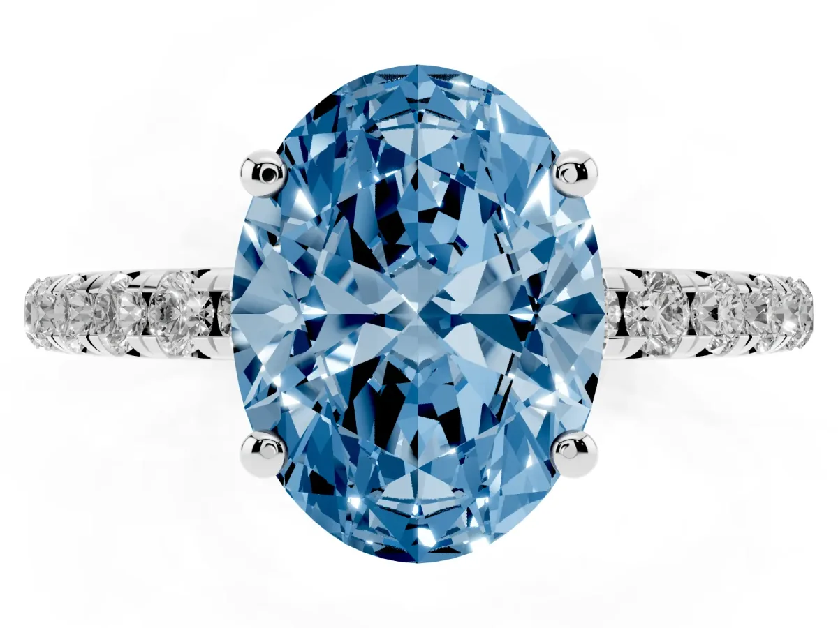 Fancy Blue Oval Cut Cut Diamond Solitaire Ring with Micro Pave Band and Four Prong Setting Silver
