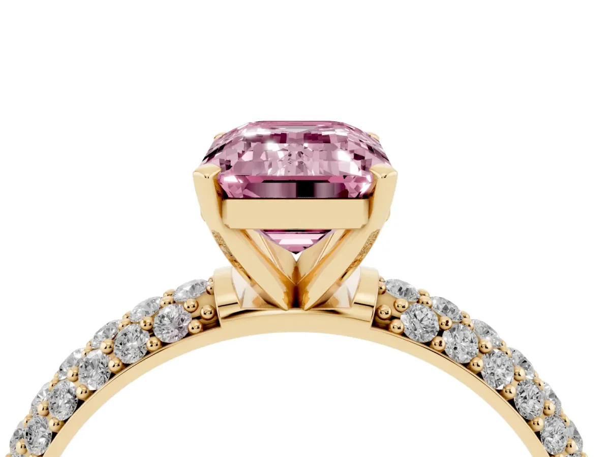 Fancy Pink Emerald Cut Diamond Solitaire Ring with Prong Setting and Pavé Band Yellow gold