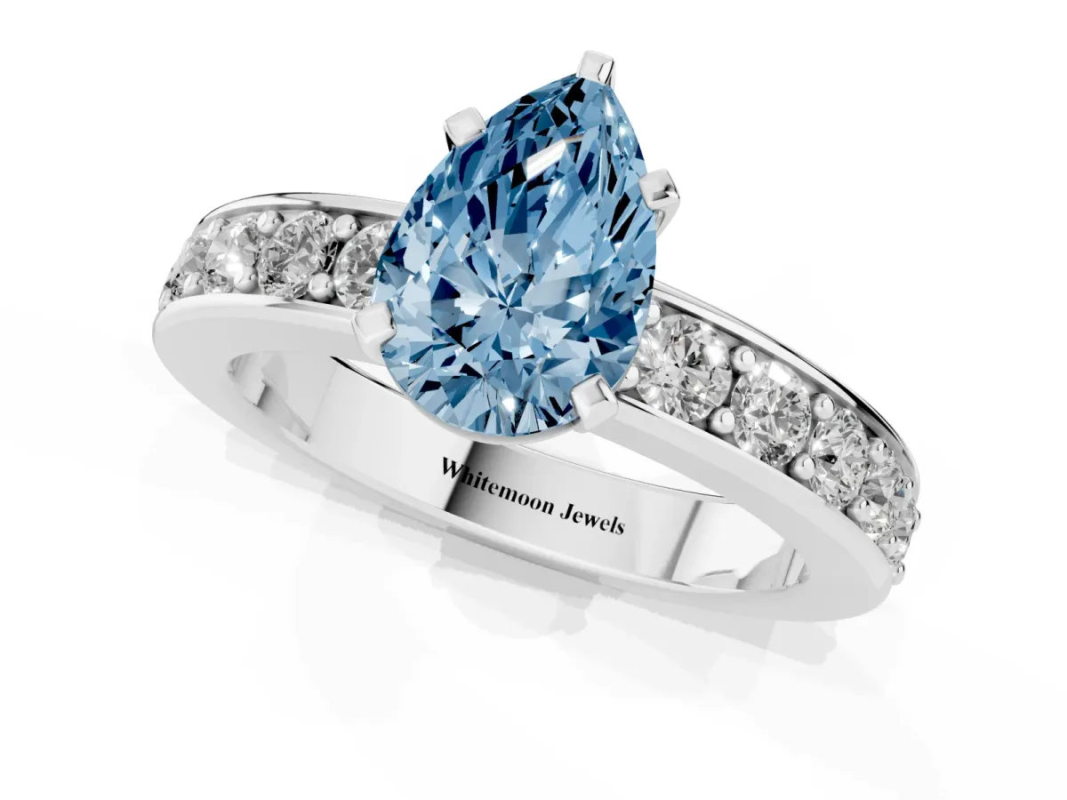 Fancy Blue Pear Cut Diamond Engagement Ring with Channel Set Round Band and Prong Setting Silver