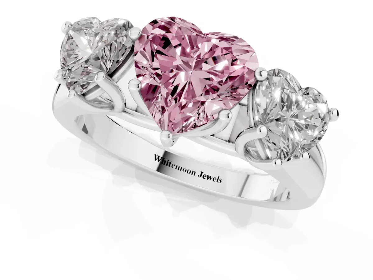 Fancy Pink Heart Cut Three-Stone Diamond Ring with Prong Setting on a Classic Band Silver