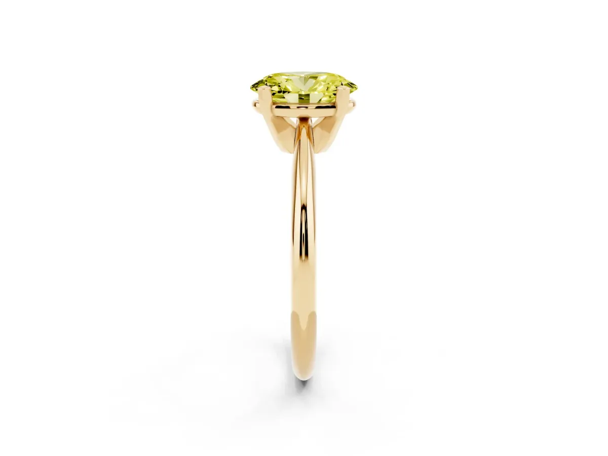 Fancy Yellow Oval Cut Cut Solitaire Ring with Four-Prong Setting on a Classic Band Yellow gold
