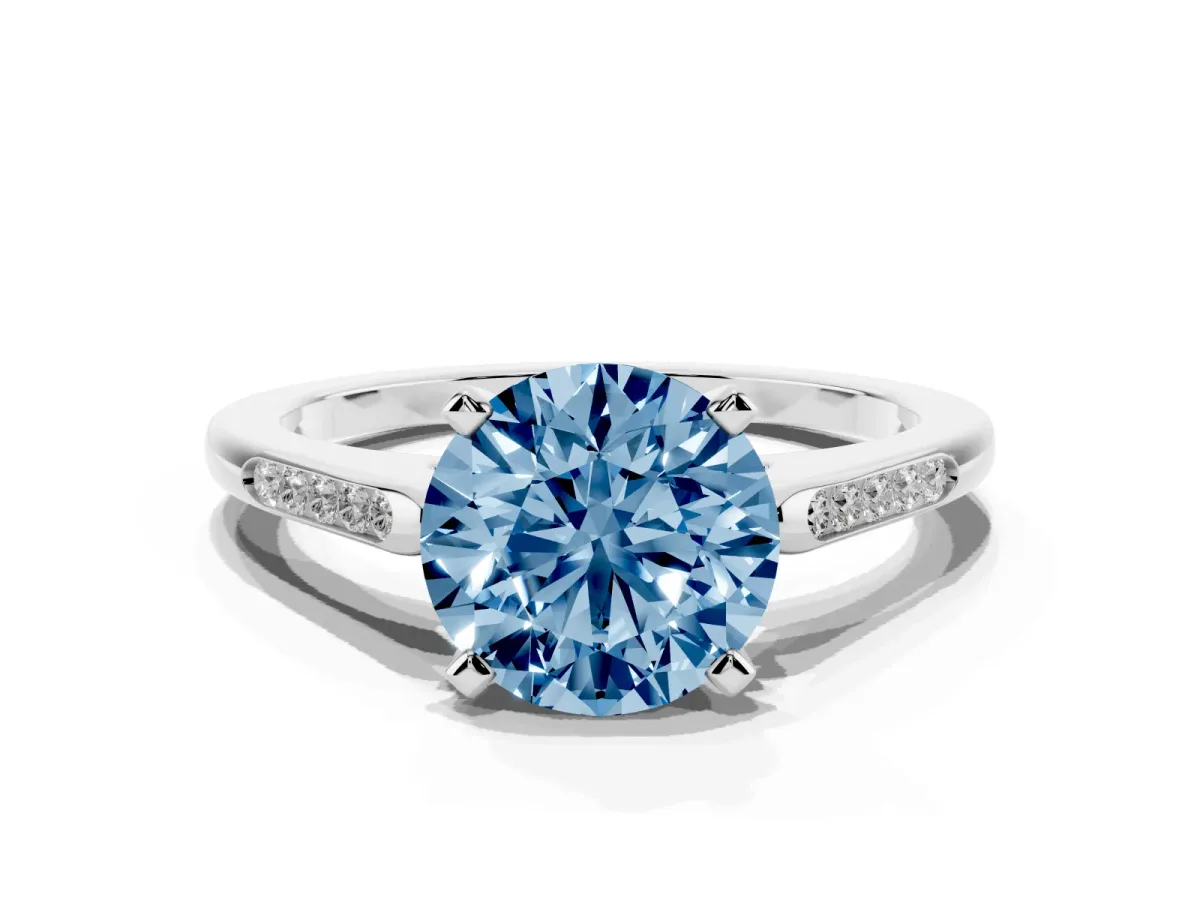 Fancy Blue Round Cut Diamond Solitaire Ring with Channel Set Round Band and Prong Setting Silver