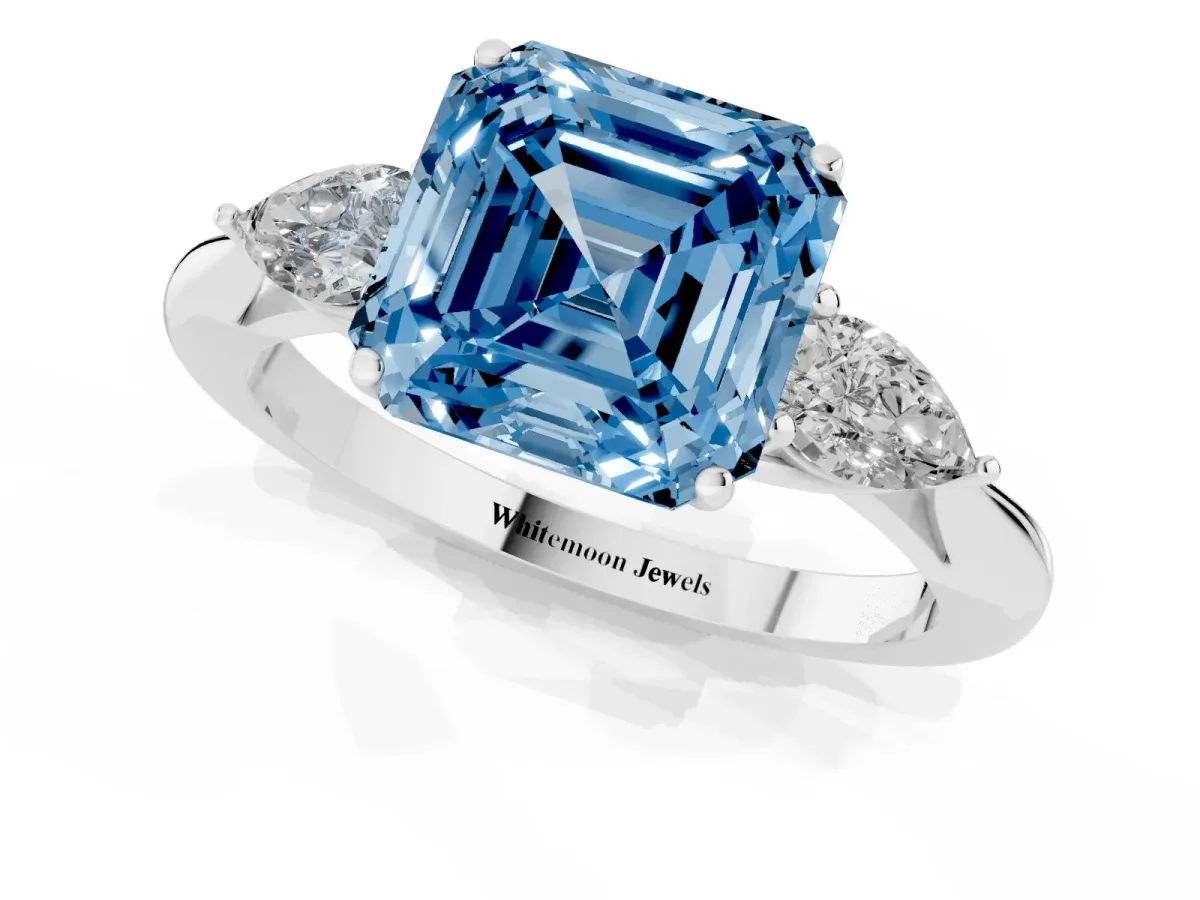 Fancy Blue Three-Stone Asscher Cut Brilliant Diamond Solitaire Ring with Tapered Band and Four-Prong Setting Platinum