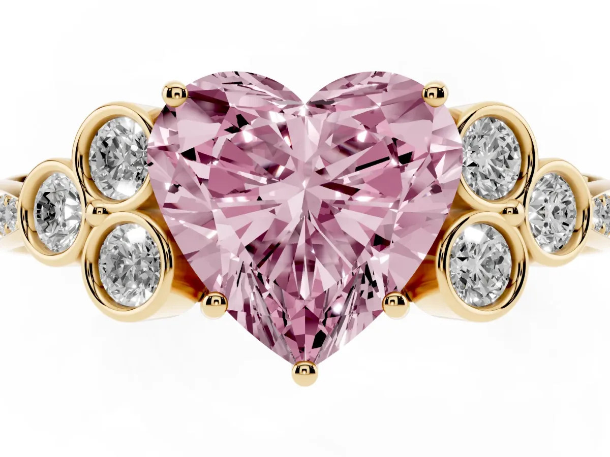 Fancy Pink Heart Cut Cut Diamond Engagement Ring with Bezel Set Round Side Stones and Prong Setting Yellow gold