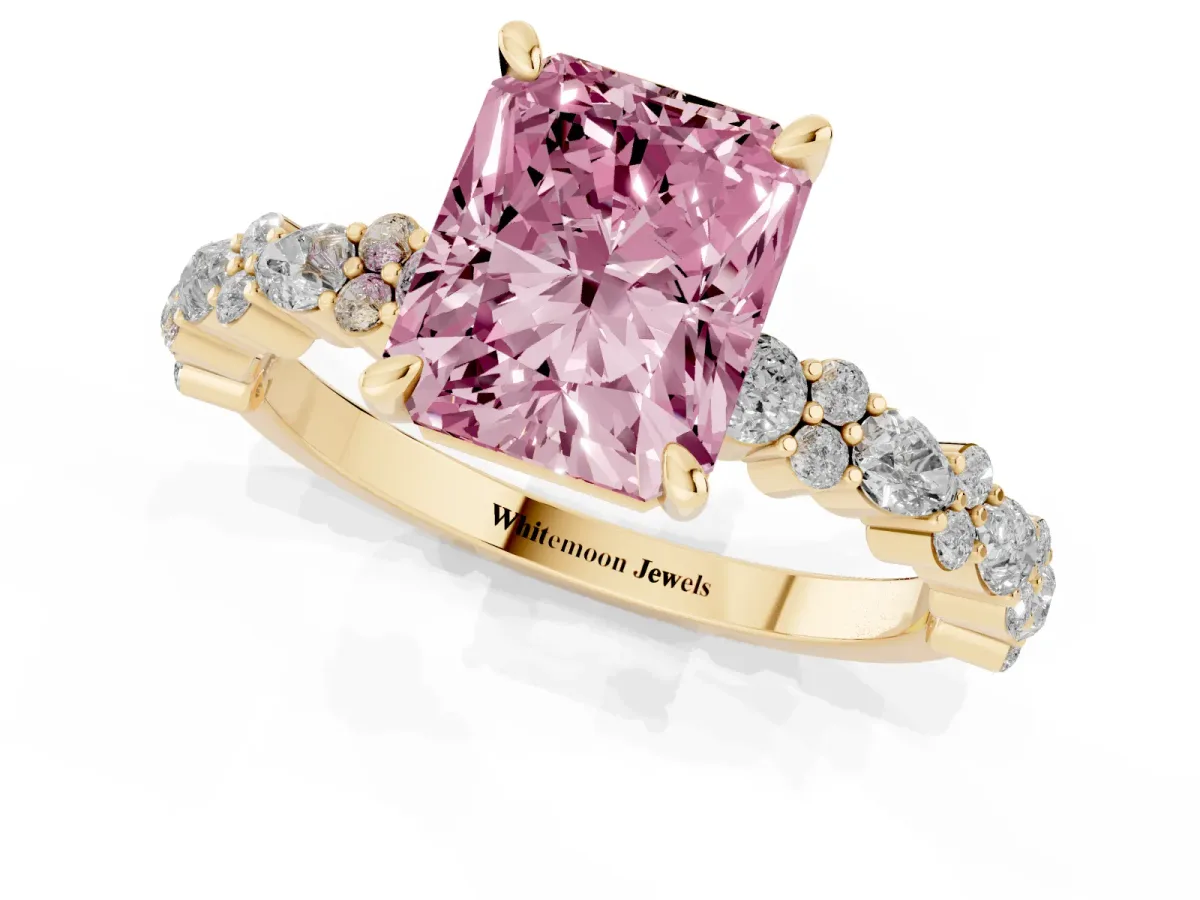 Fancy Pink Radiant Cut Diamond Side Stone Solitaire Ring with Round and Four-Prong Setting Yellow gold