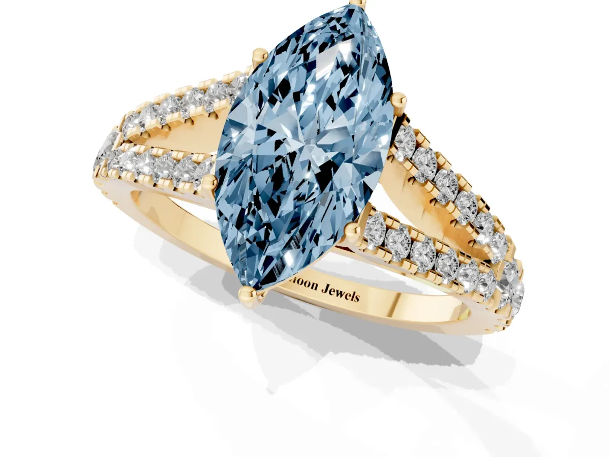 Fancy Blue Marquise Cut Diamond Split Shank Engagement Ring with Round Pavé and Prong Setting Yellow gold