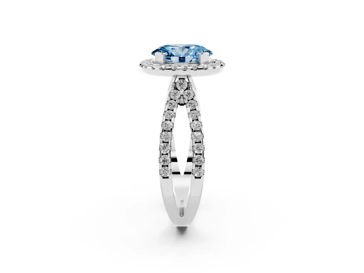 Fancy Blue Oval Cut Diamond Halo Ring with Split Shank Pavé Band and Prong Setting Silver