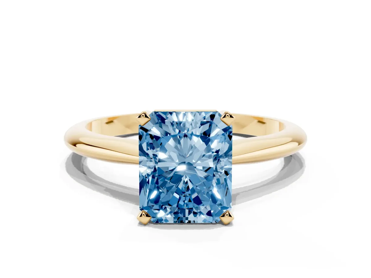 Fancy Blue Radiant Cut Cut Solitaire Ring with Four-Prong Setting on a Classic Band Yellow gold