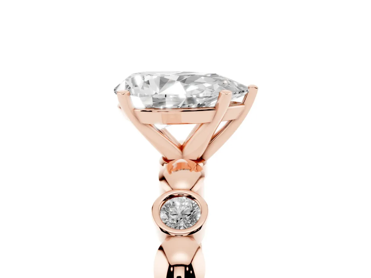 Pear Cut Solitaire Bezel-Set Diamond Ring with Beaded Band and Four-Prong Setting Rose gold