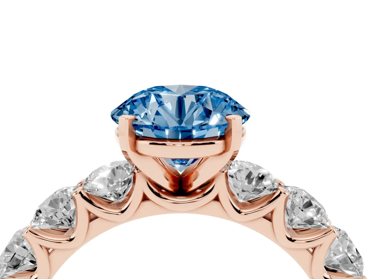 Fancy Blue Round Cut Diamond Prong Setting with Side Stones on a Pave Band Rose gold