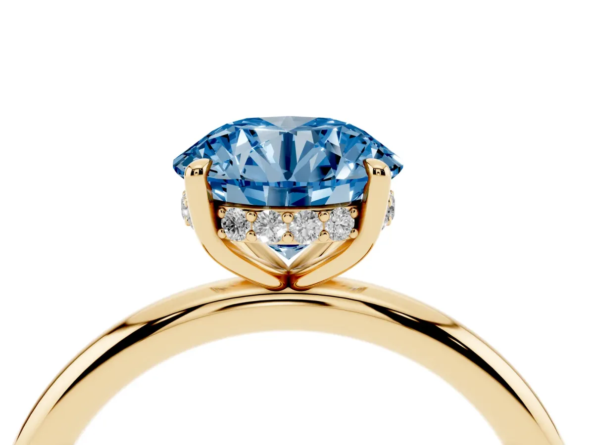 Fancy Blue Round Cut Diamond Solitaire Ring with Thin Band and Four-Prong Setting Yellow gold